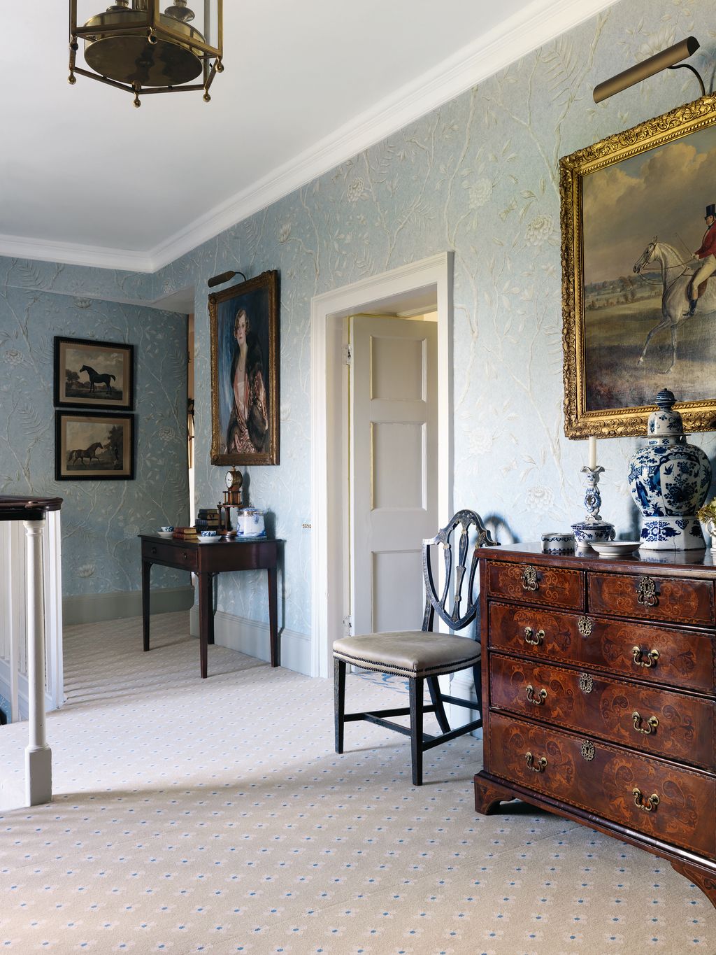 Image may contain Furniture Flooring Human Person Living Room Room Indoors Interior Design Wood and Hardwood