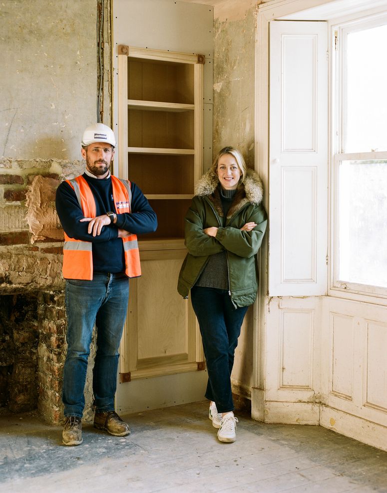 Image may contain: Pants, Clothing, Apparel, Human, Person, Shoe, Footwear, Jeans, Denim, Helmet, Wood, Shelf, and Hardhat