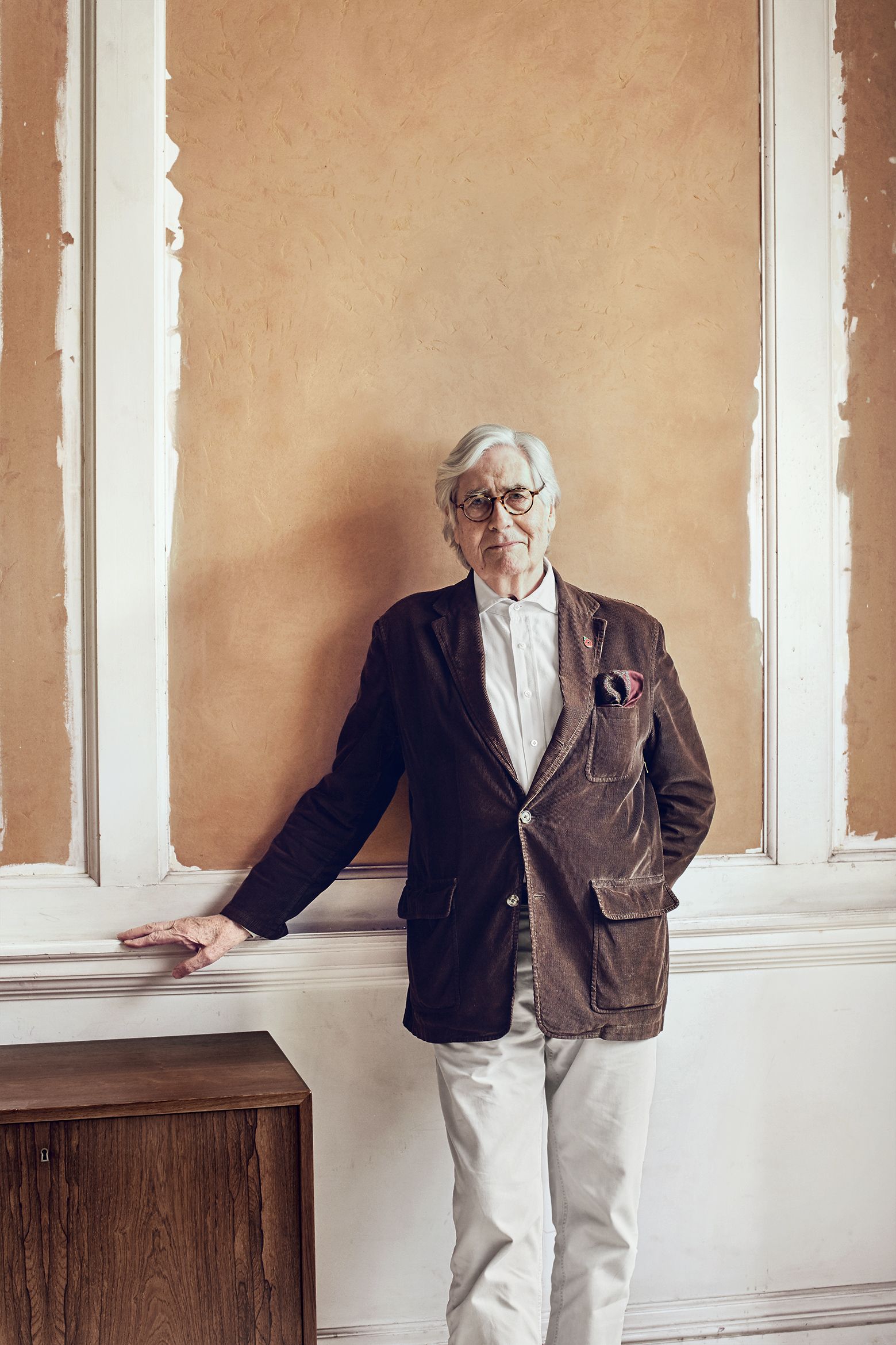 Image may contain Clothing Apparel Wood Jacket Coat Human Person Plywood Suit Overcoat Blazer and Hardwood