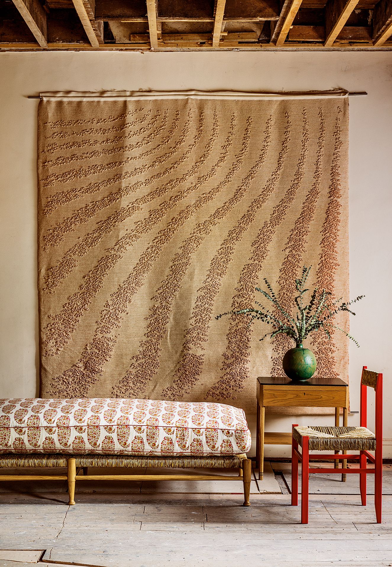 Image may contain Room Indoors Bedroom Home Decor Interior Design Furniture Chair Rug Wall Wood and Living Room