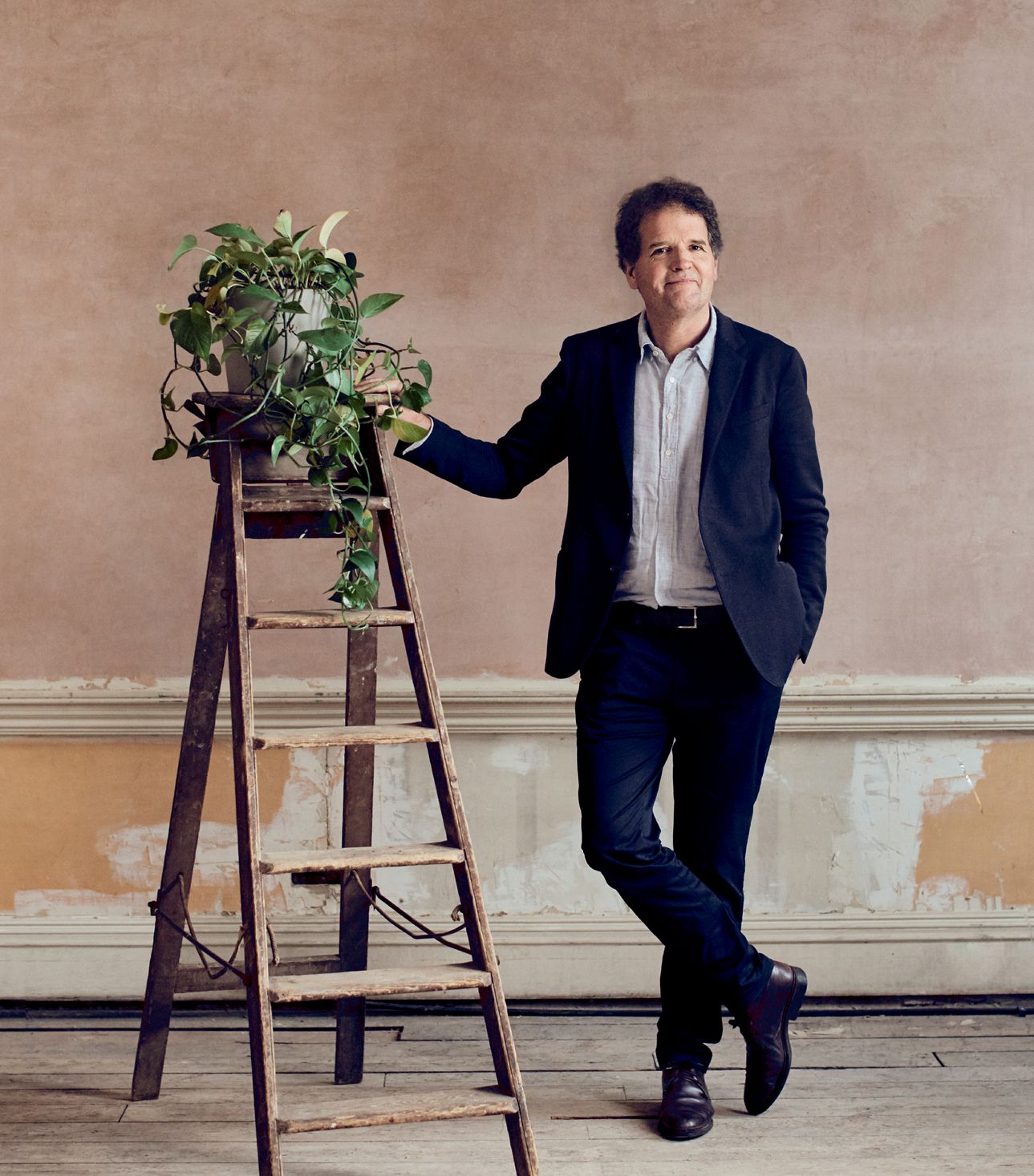 Image may contain Clothing Apparel Footwear Shoe Human Person Suit Coat and Overcoat