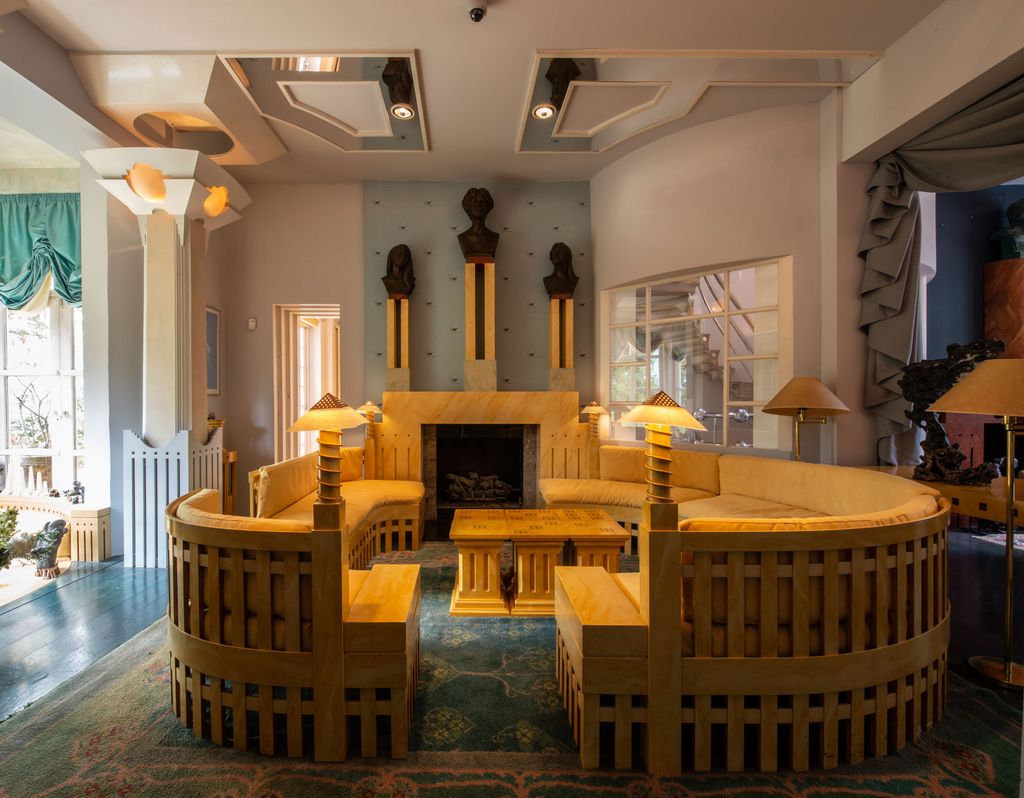 Image may contain Flooring Wood Floor Hardwood Furniture Couch Plywood Living Room Room and Indoors