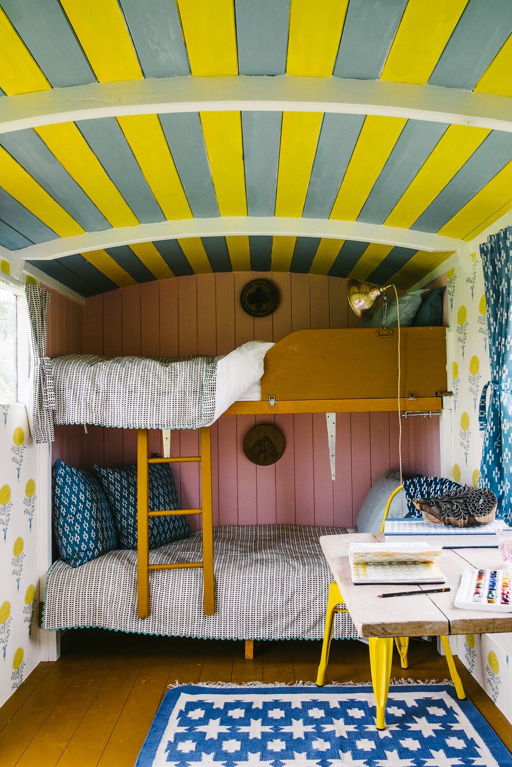 Image may contain Furniture Bed Bunk Bed Room Bedroom Indoors Rug Interior Design Dorm Room Crib and Housing