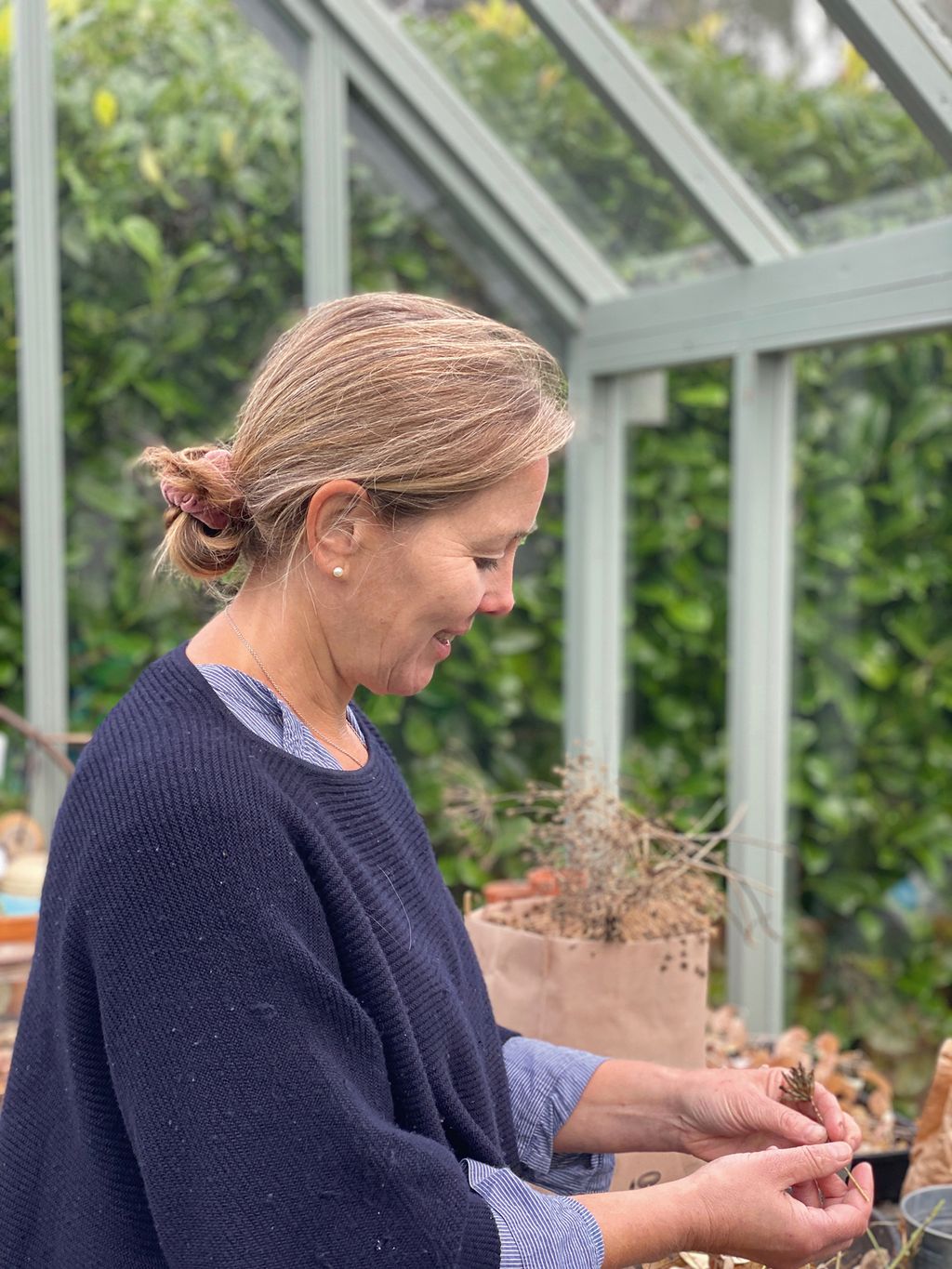 Image may contain Clothing Apparel Human Person Sleeve Vase Plant Pottery Potted Plant Jar and Long Sleeve