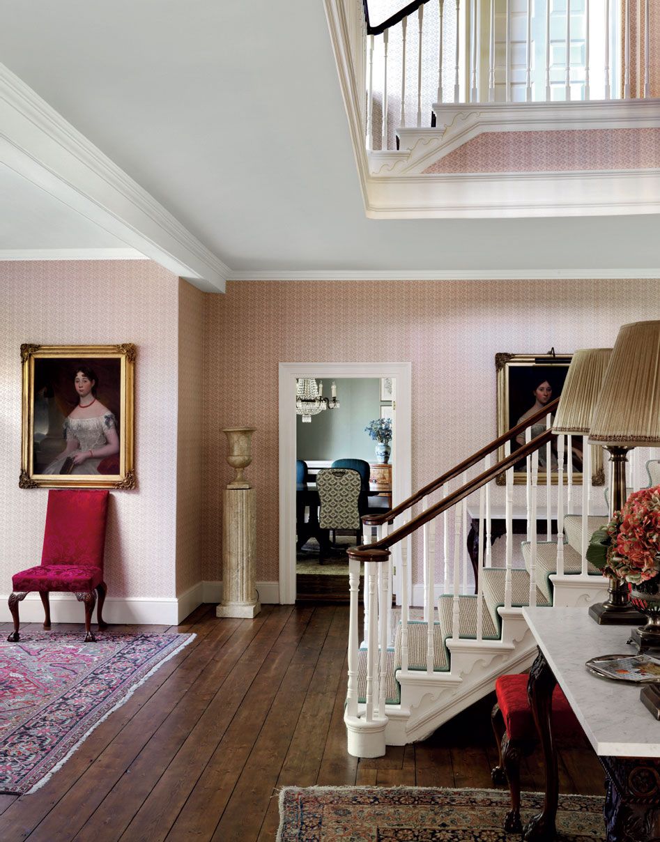 A pair of 18thcentury chairs upholstered in ‘Luce red silk damask by Fadini Borghi from Pierre Frey contrast with Robert...