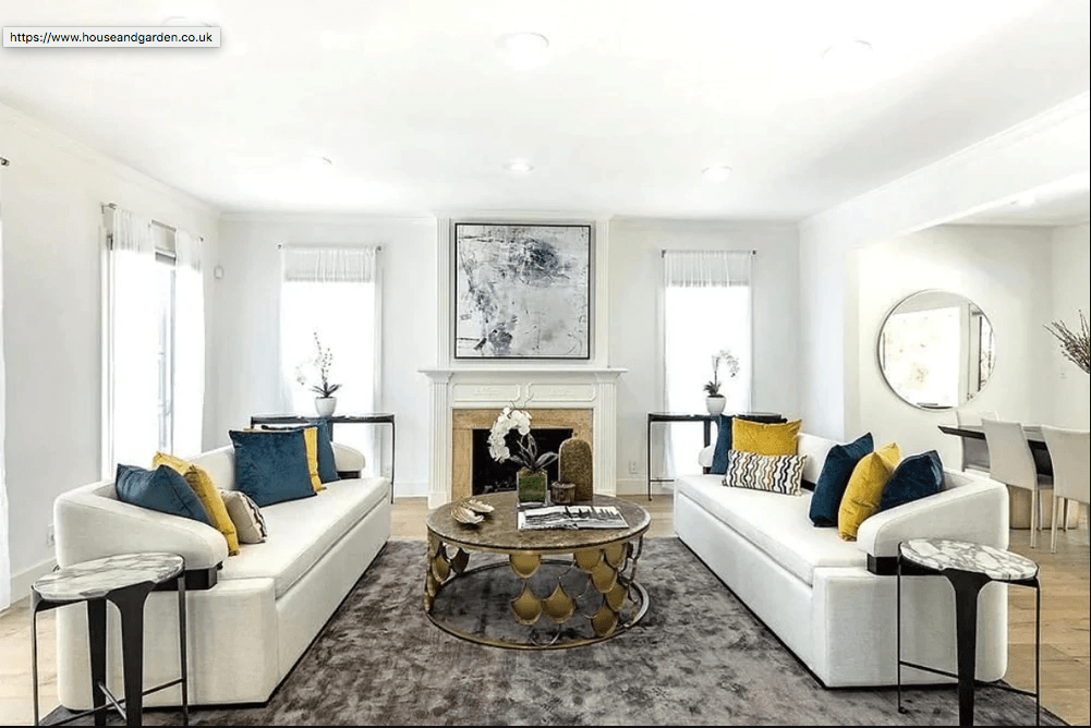 Image may contain Furniture Table Coffee Table Living Room Room Indoors Couch Rug Cushion Housing and Building