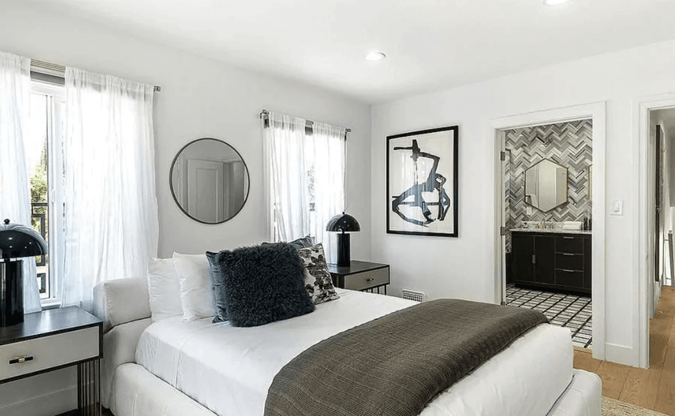 Image may contain Indoors Room Bedroom Furniture Cushion Pillow Bed Interior Design and Dorm Room