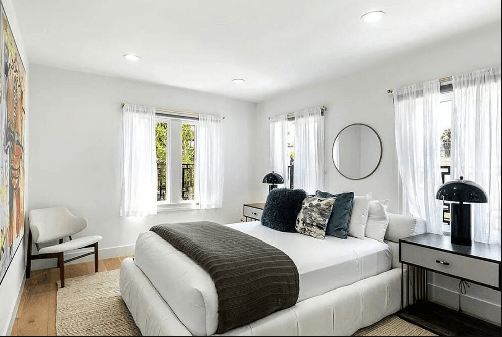 Image may contain Room Bedroom Indoors Furniture Cushion Corner Pillow Couch Living Room and Interior Design