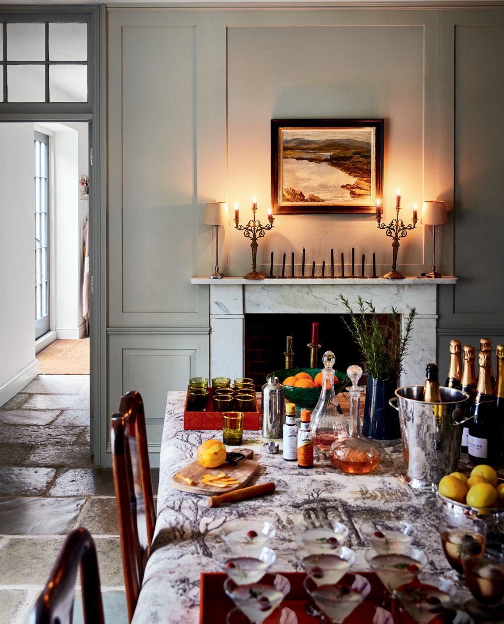 Image may contain Flooring Indoors Furniture Room Living Room Dining Table Table Dining Room Wood and Plant