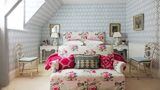 Image may contain Indoors Room Living Room Furniture Chair Cushion Pillow Couch Interior Design and Bedroom