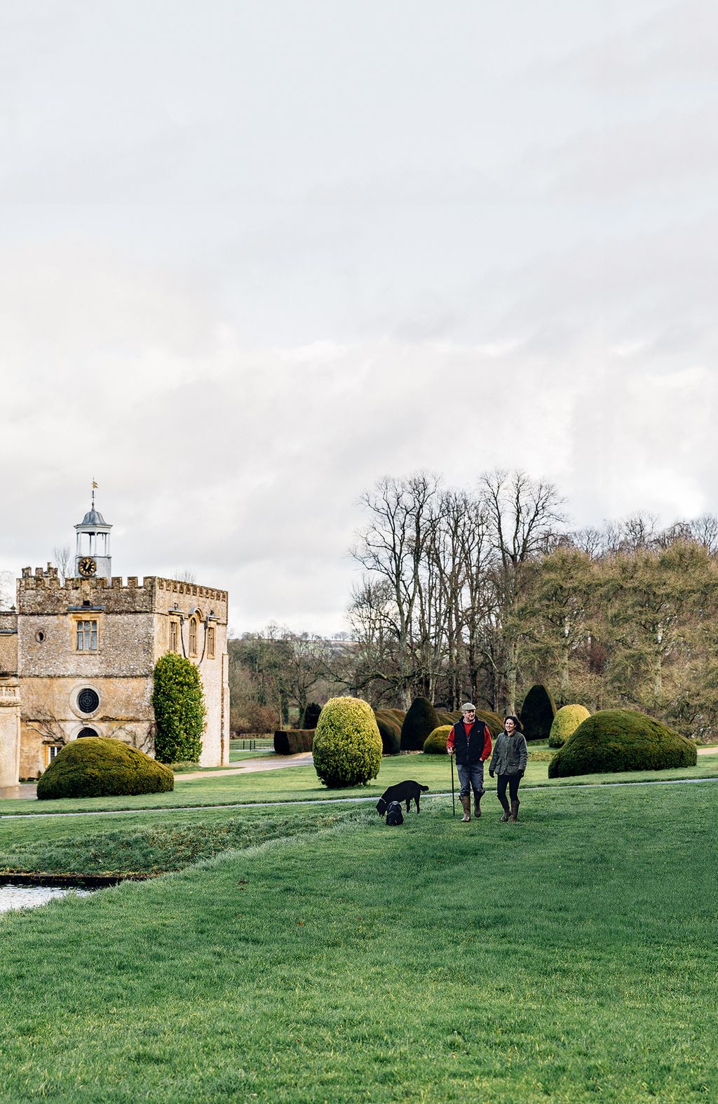 Image may contain Grass Plant Human Person Architecture Building Castle Lawn Animal Dog Mammal Pet and Canine