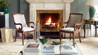 Living room design ideas. Image may contain Fireplace Indoors Living Room Room Furniture Chair Hearth Home Decor...