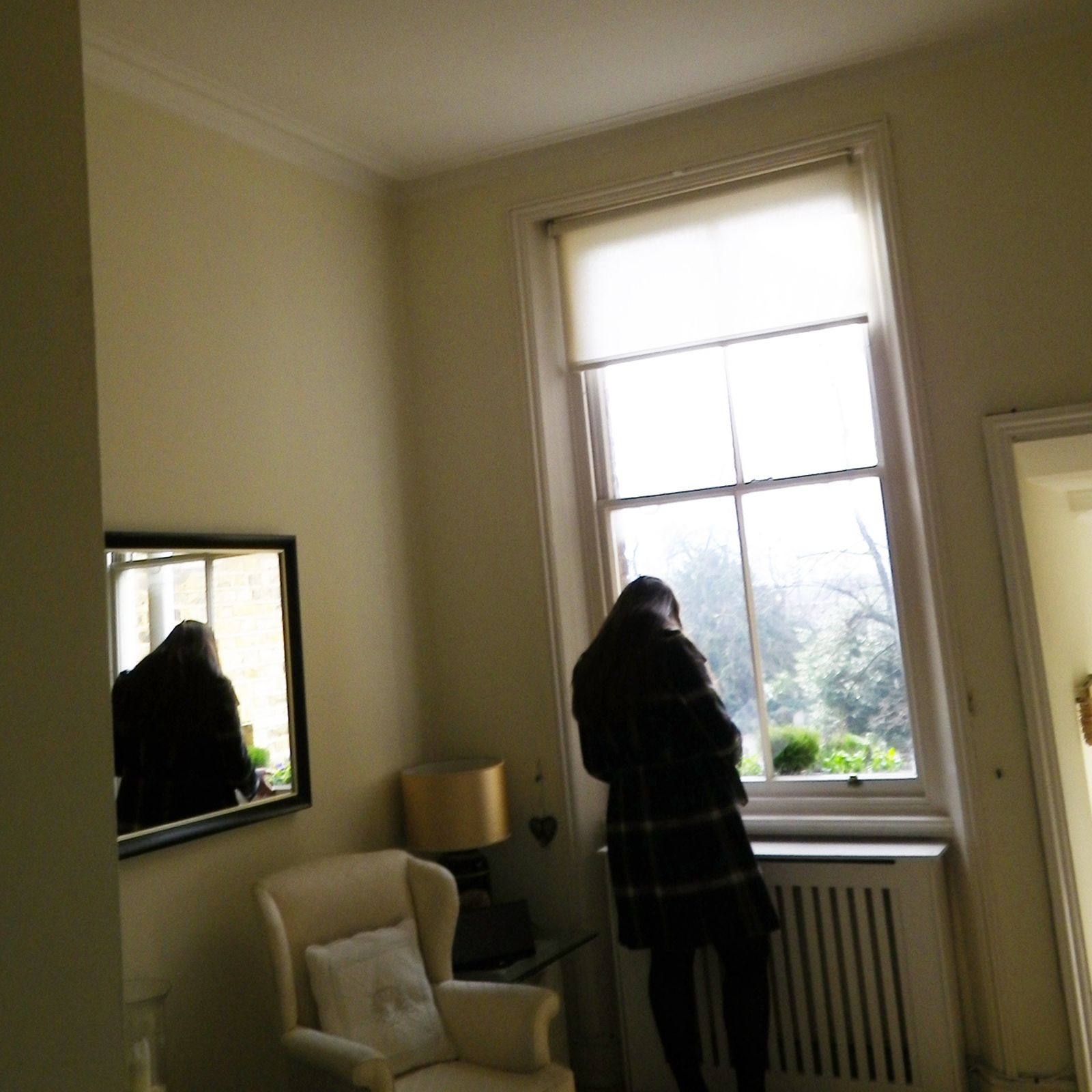 Image may contain Living Room Room Indoors Interior Design Human Person Home Decor Furniture Couch and Flooring