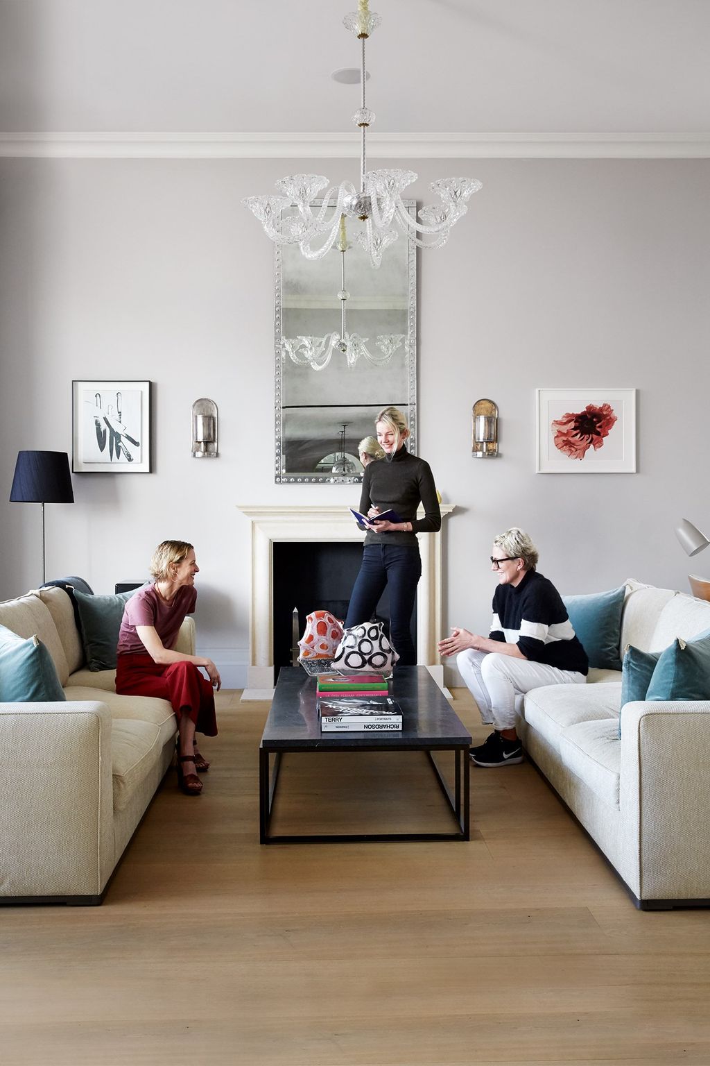 Image may contain Living Room Room Indoors Furniture Human Person Couch Table Interior Design and Coffee Table