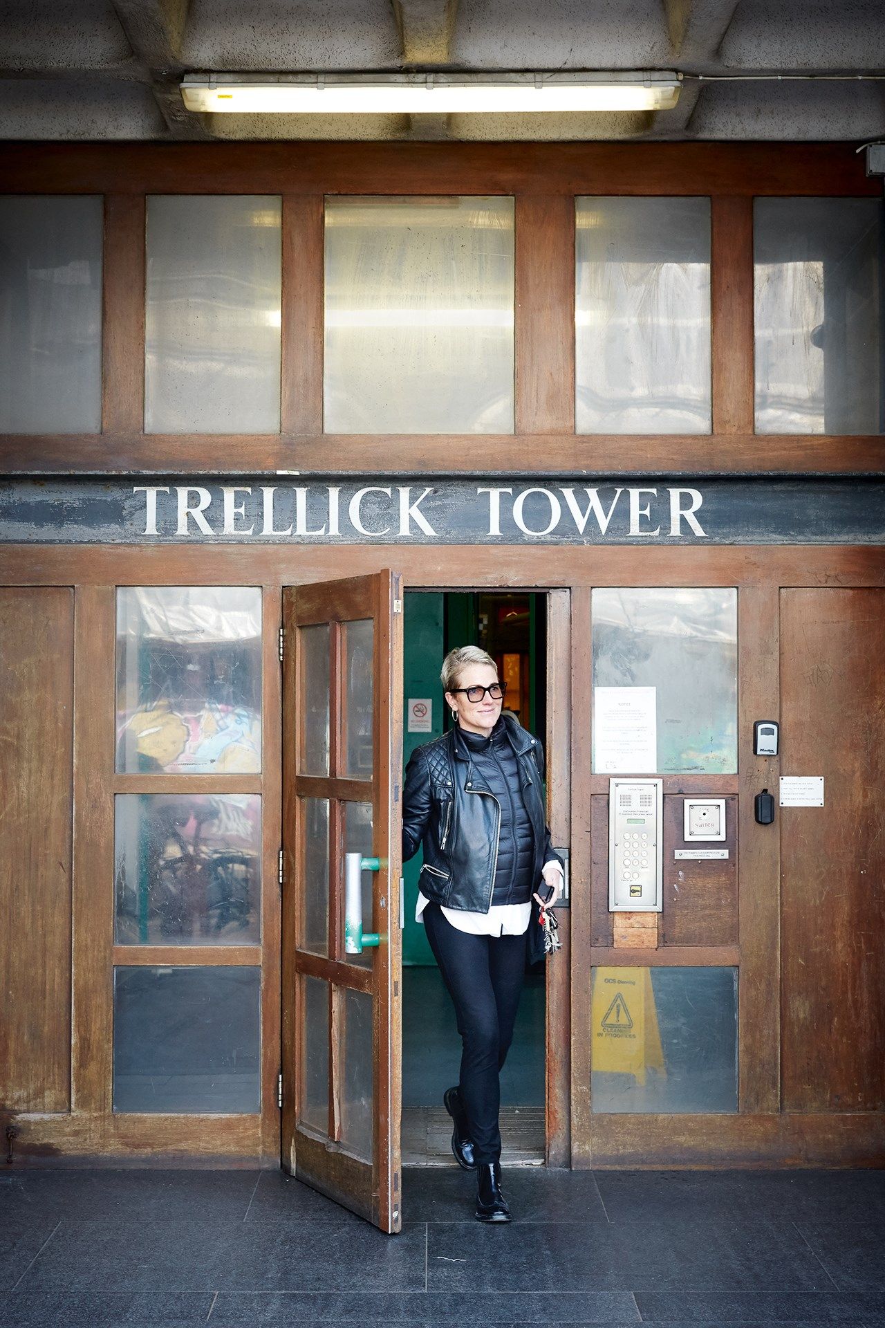 Image may contain Human Person Clothing Apparel Jacket Coat and Door