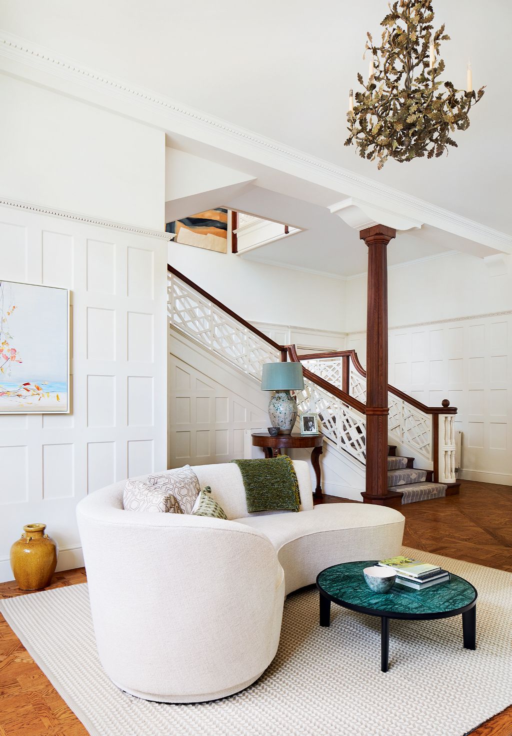 Image may contain Living Room Room Indoors Furniture Rug and Table