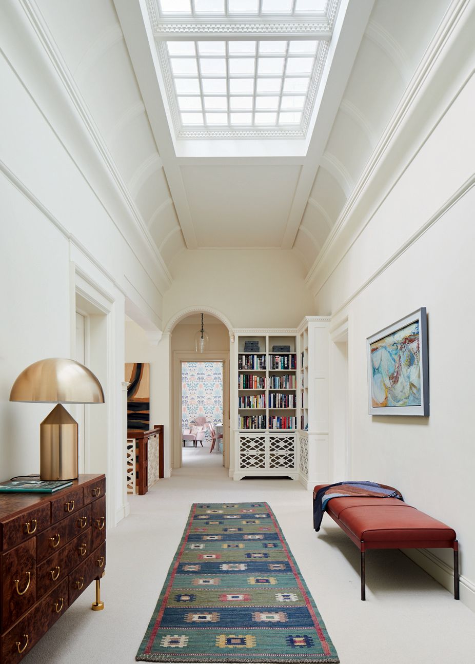 Image may contain Interior Design Indoors Furniture Rug Building Room Bedroom Architecture Flooring and Housing