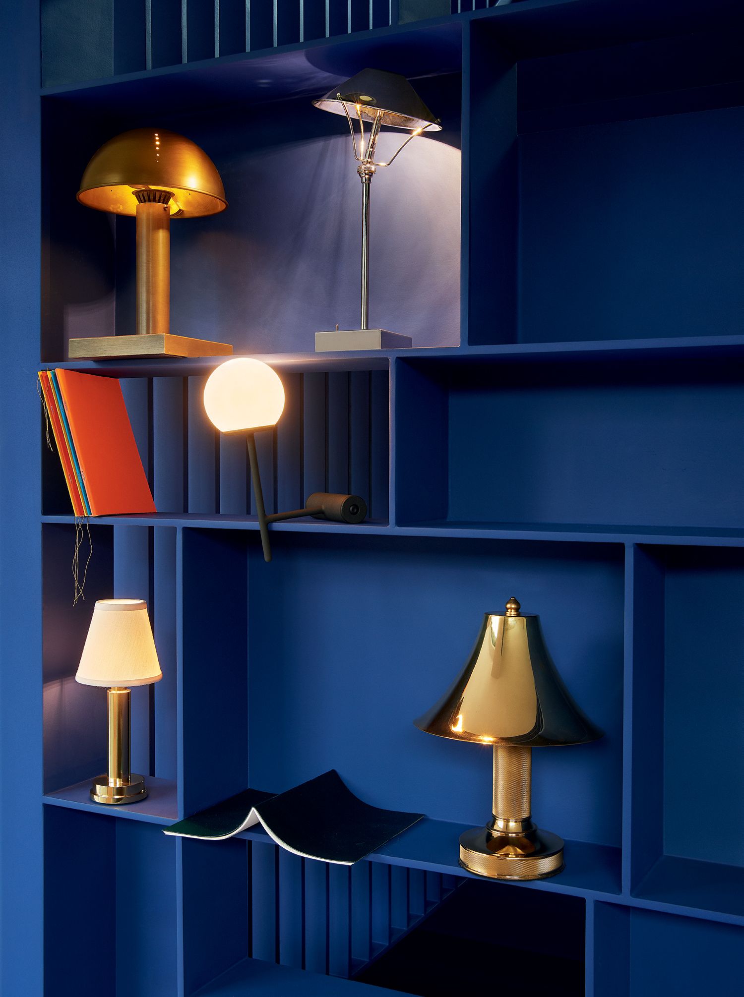 Image may contain Lighting Lamp Table Lamp Furniture Shelf and Lampshade