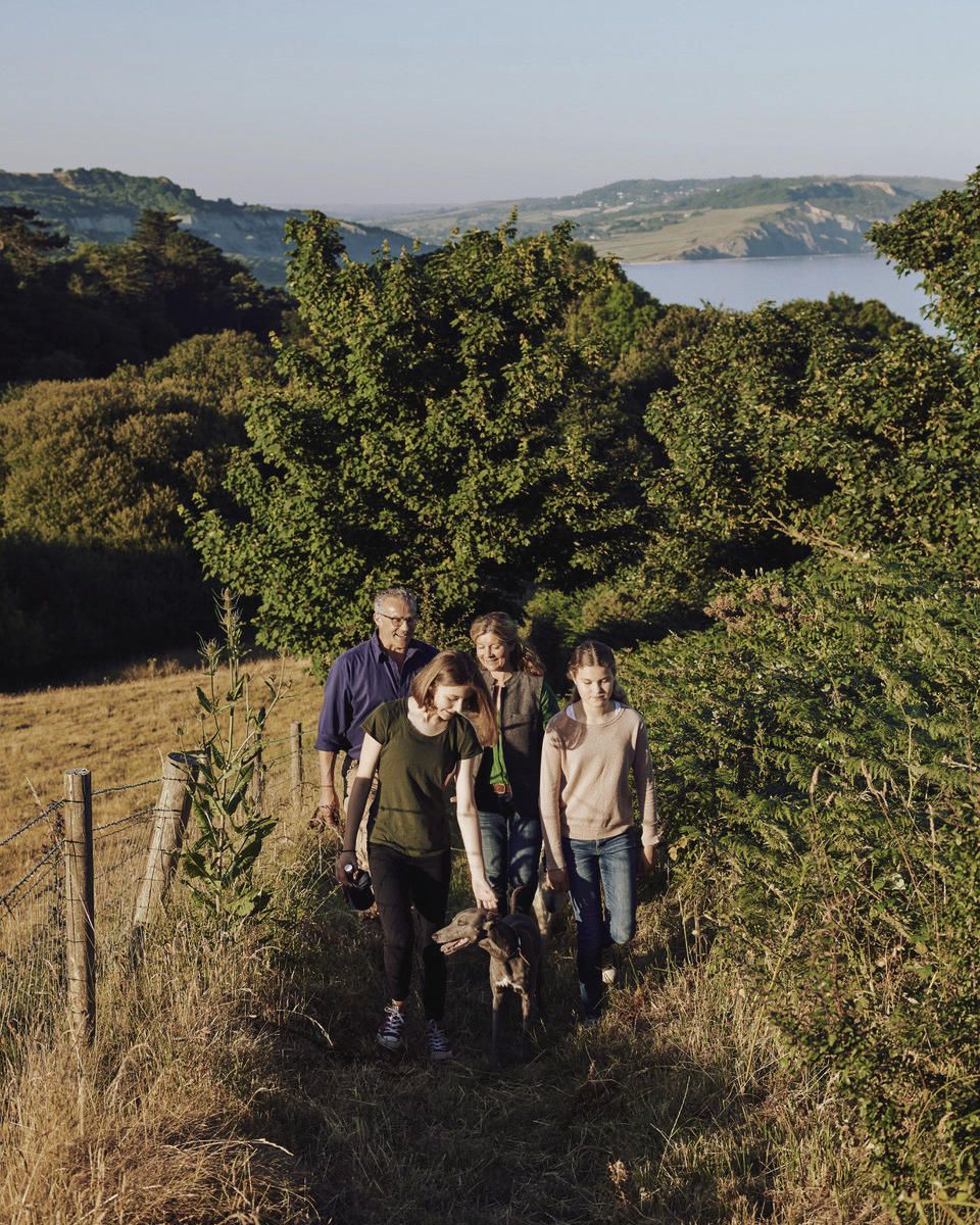 Image may contain Human Person Outdoors Nature Grassland Field Countryside Rural Farm and Meadow