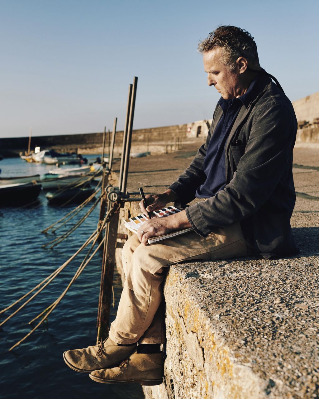 Image may contain Vehicle Transportation Watercraft Vessel Human Person Water Waterfront Dock Port and Pier