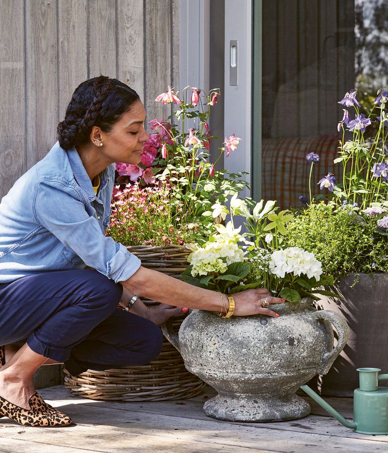 Image may contain: Human, Person, Plant, Flower, Blossom, Flower Arrangement, and Flower Bouquet