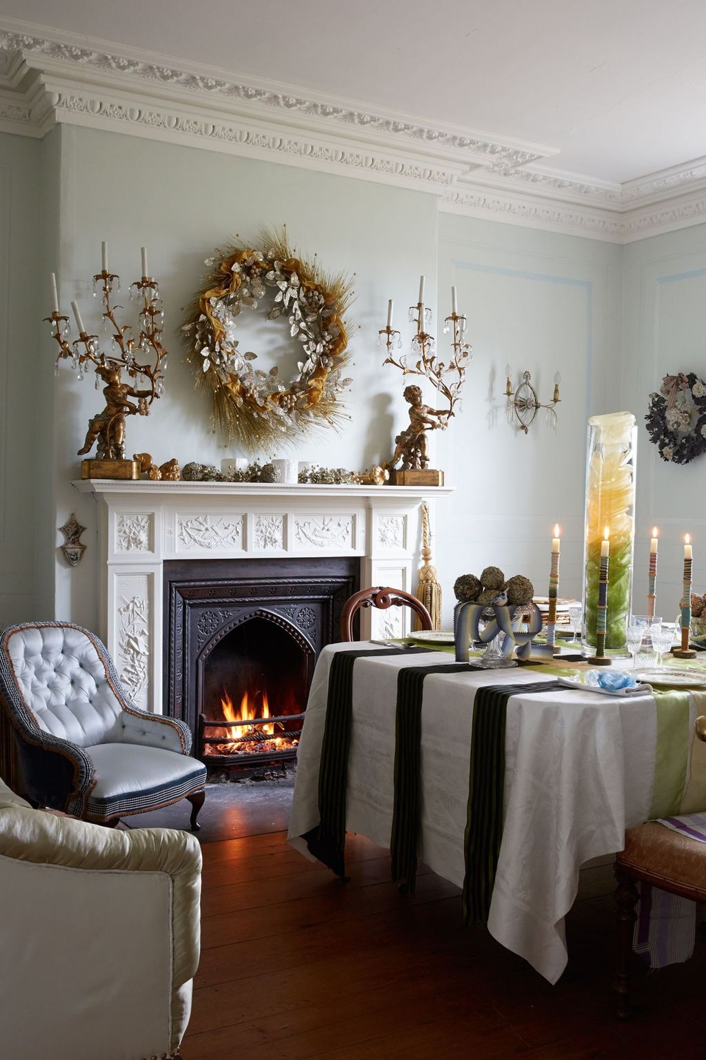 Image may contain Home Decor Fireplace Indoors Hearth Furniture and Chair