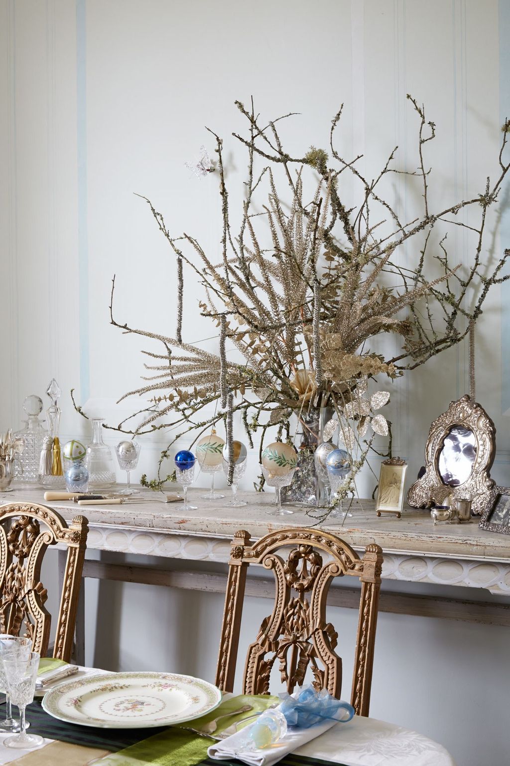 Image may contain Home Decor Furniture Interior Design Indoors Dining Table Table Tabletop Chair and Plant