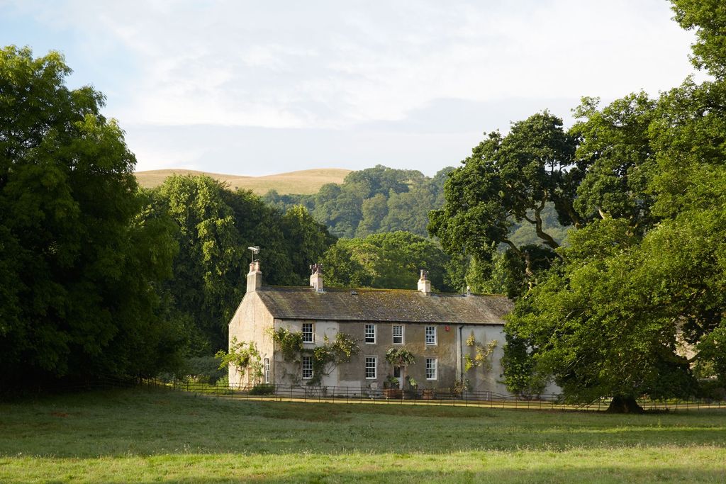 Image may contain Nature Outdoors Grass Plant Building Countryside Rural Hut Cottage Housing and House