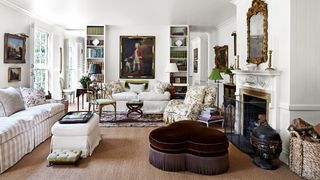 Image may contain Furniture Living Room Indoors Room Couch Interior Design Human Person and Rug