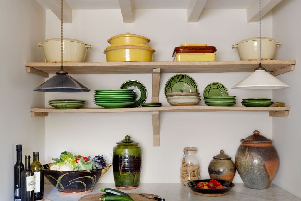 Image may contain Shelf Furniture Bowl Pottery Cupboard Closet Porcelain and Art