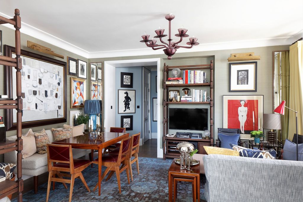 Image may contain Furniture Chair Living Room Room Indoors Dining Room Interior Design Dining Table Table and Lamp