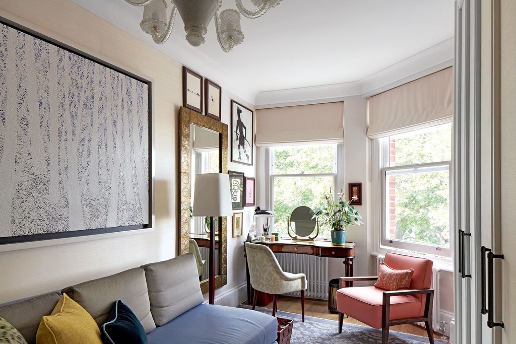 Image may contain Furniture Living Room Indoors Room Couch Interior Design and Chair