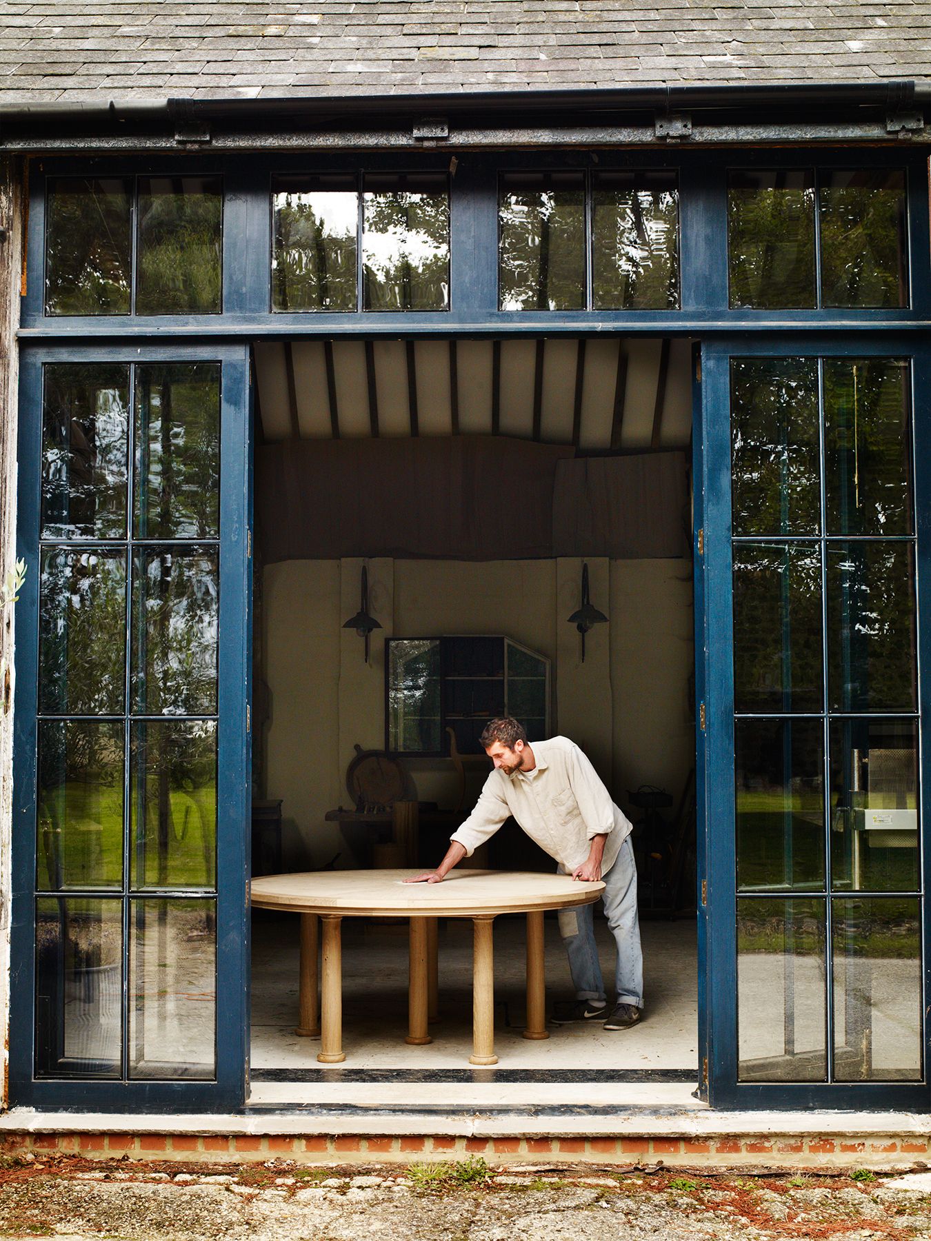 Image may contain Human Person Door Clothing Shoe Footwear Apparel and Folding Door