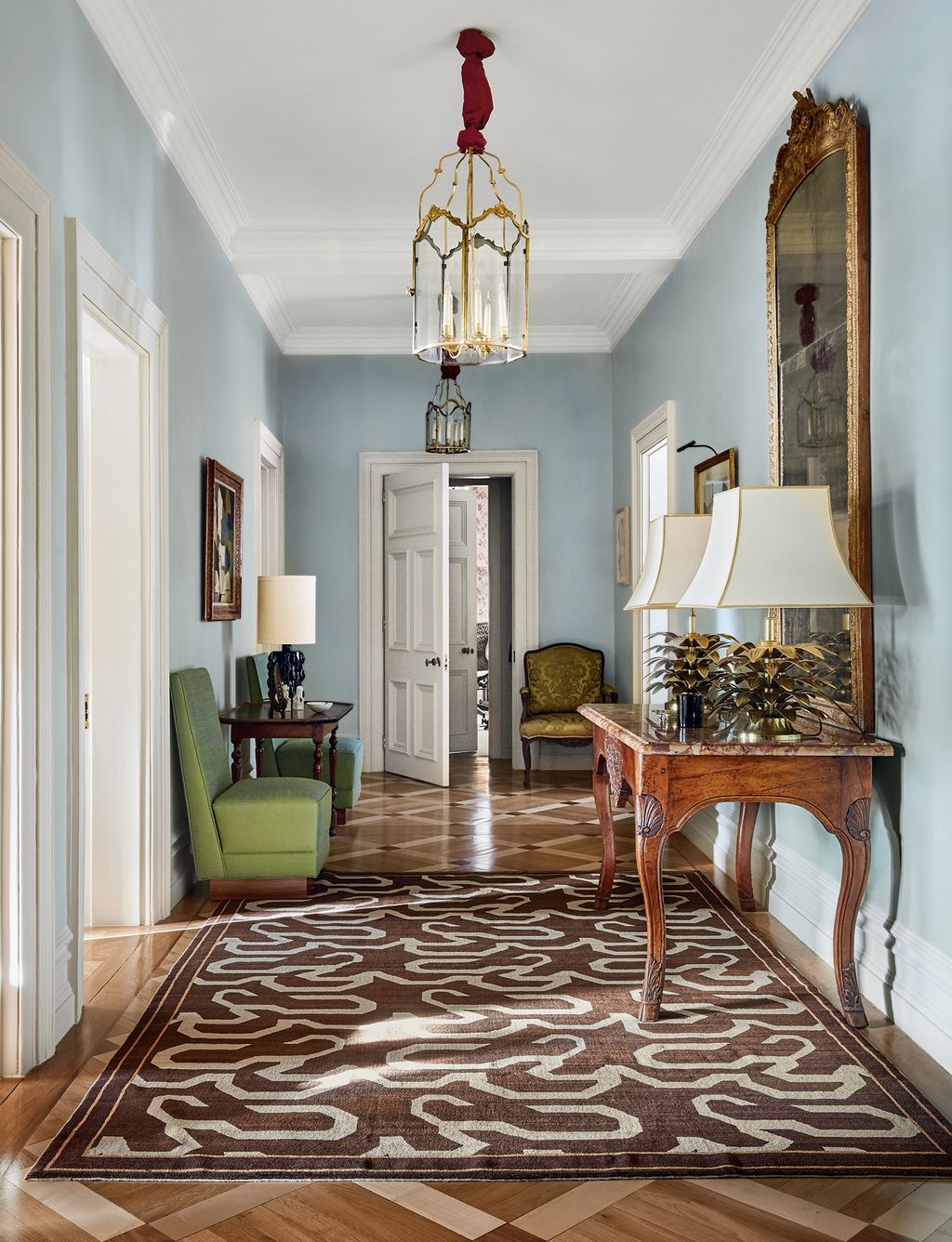 Image may contain Flooring Floor Rug Hardwood Wood Living Room Indoors and Room