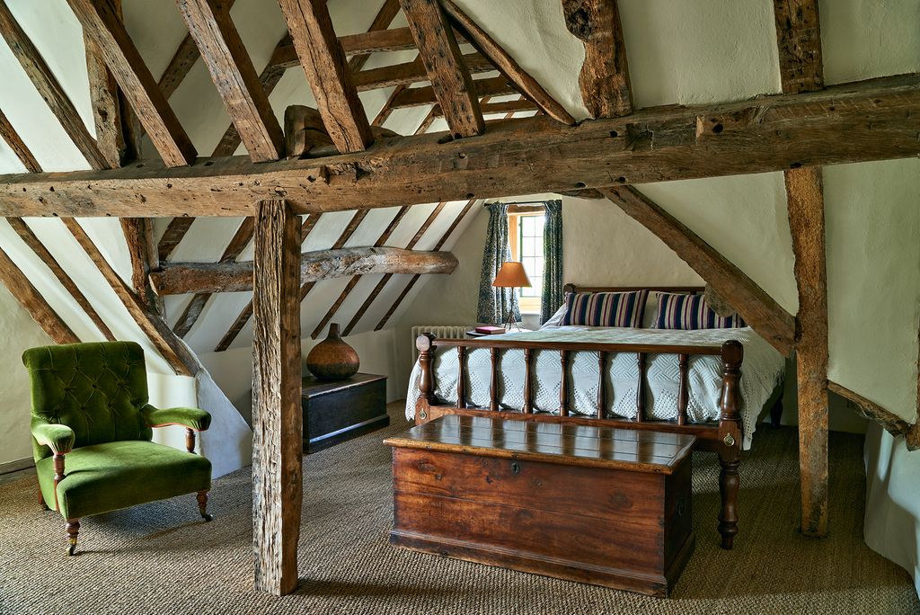 Image may contain Housing Building Loft Indoors Attic Interior Design Furniture Wood Living Room Room and Hardwood