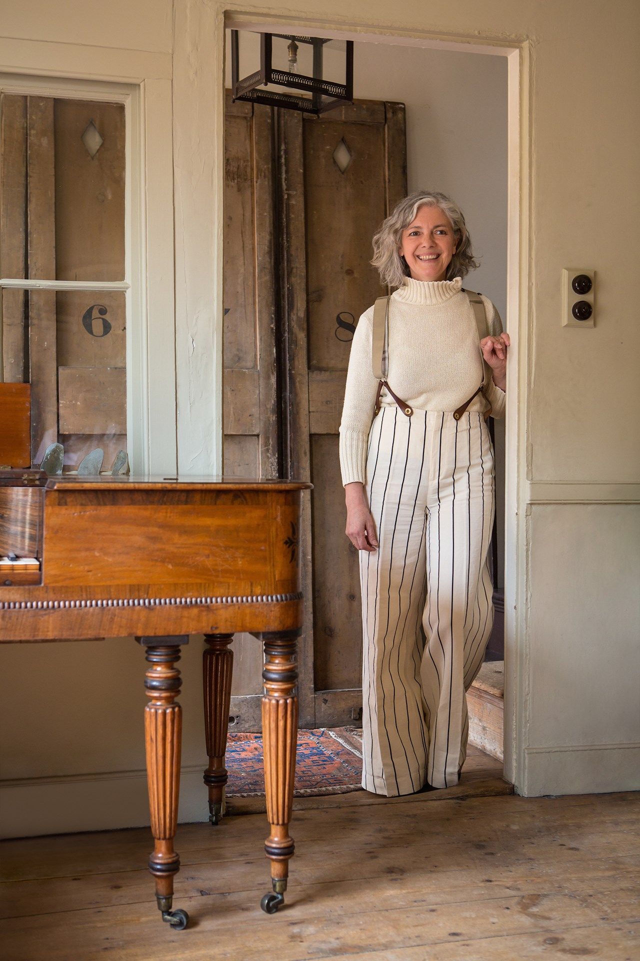 Image may contain Human Person Musical Instrument Piano Leisure Activities Grand Piano and Home Decor