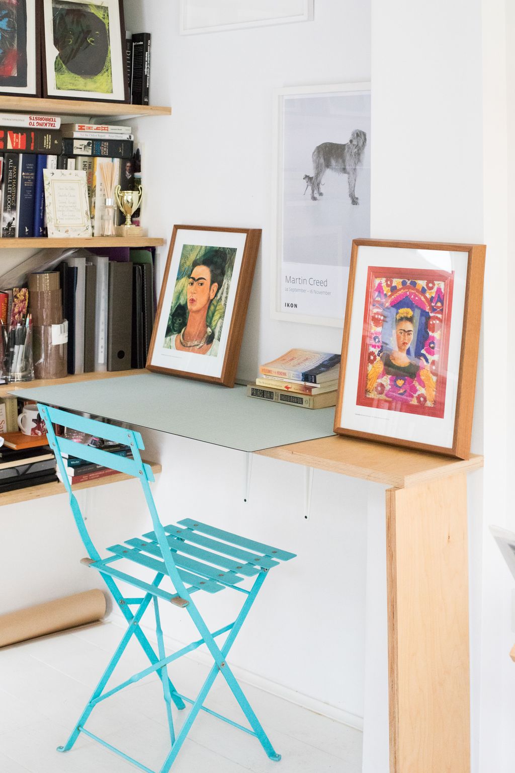 Image may contain Furniture Desk Table Shelf Chair Frida Kahlo and Bookcase