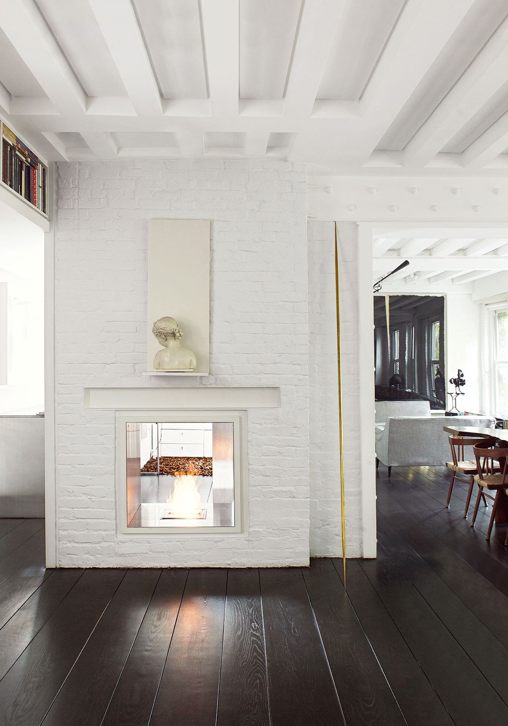 ‘She is very uncomfortable being looked at says Ghiora of the marble bust above his fireplace  the original hearth of...