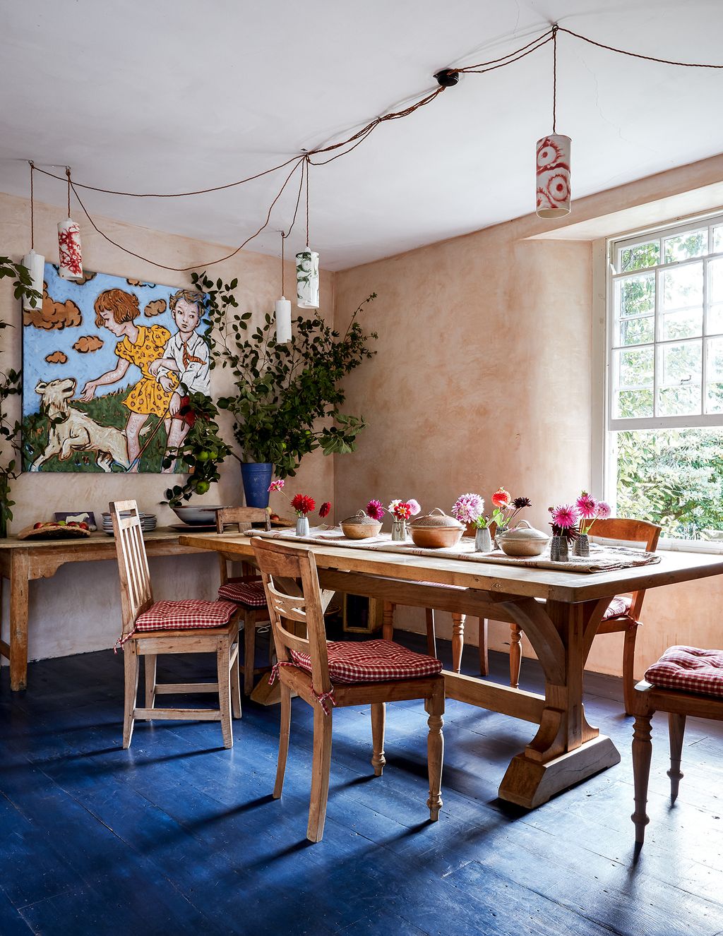 Image may contain Furniture Chair Room Indoors Dining Room Interior Design Marie Laurencin Flooring Wood and Table