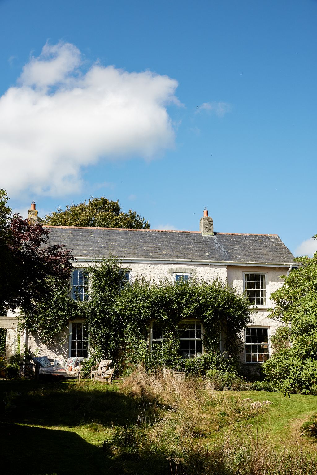 Image may contain Cottage Housing House Building Outdoors Nature Plant Grass Tree Shelter Countryside and Rural