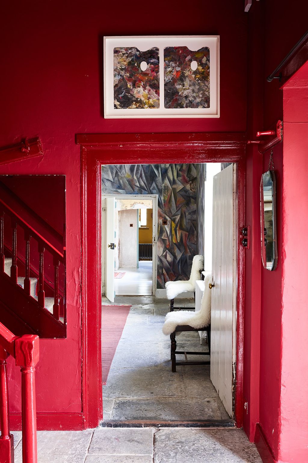 Image may contain Flooring Floor Living Room Room Indoors Interior Design Furniture Couch and Door