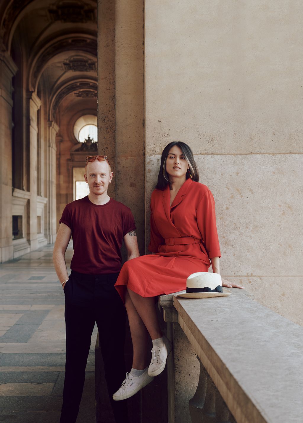 Image may contain Human Person Monk Footwear Clothing Shoe Apparel Sitting Corridor and Flooring