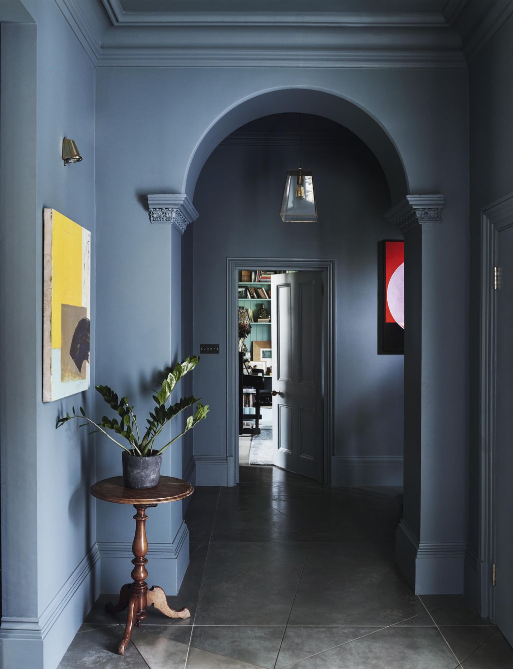 In this London house designed by Rachel Chudley walls in a stormy grey created by paint specialist Donald Kaufman create...