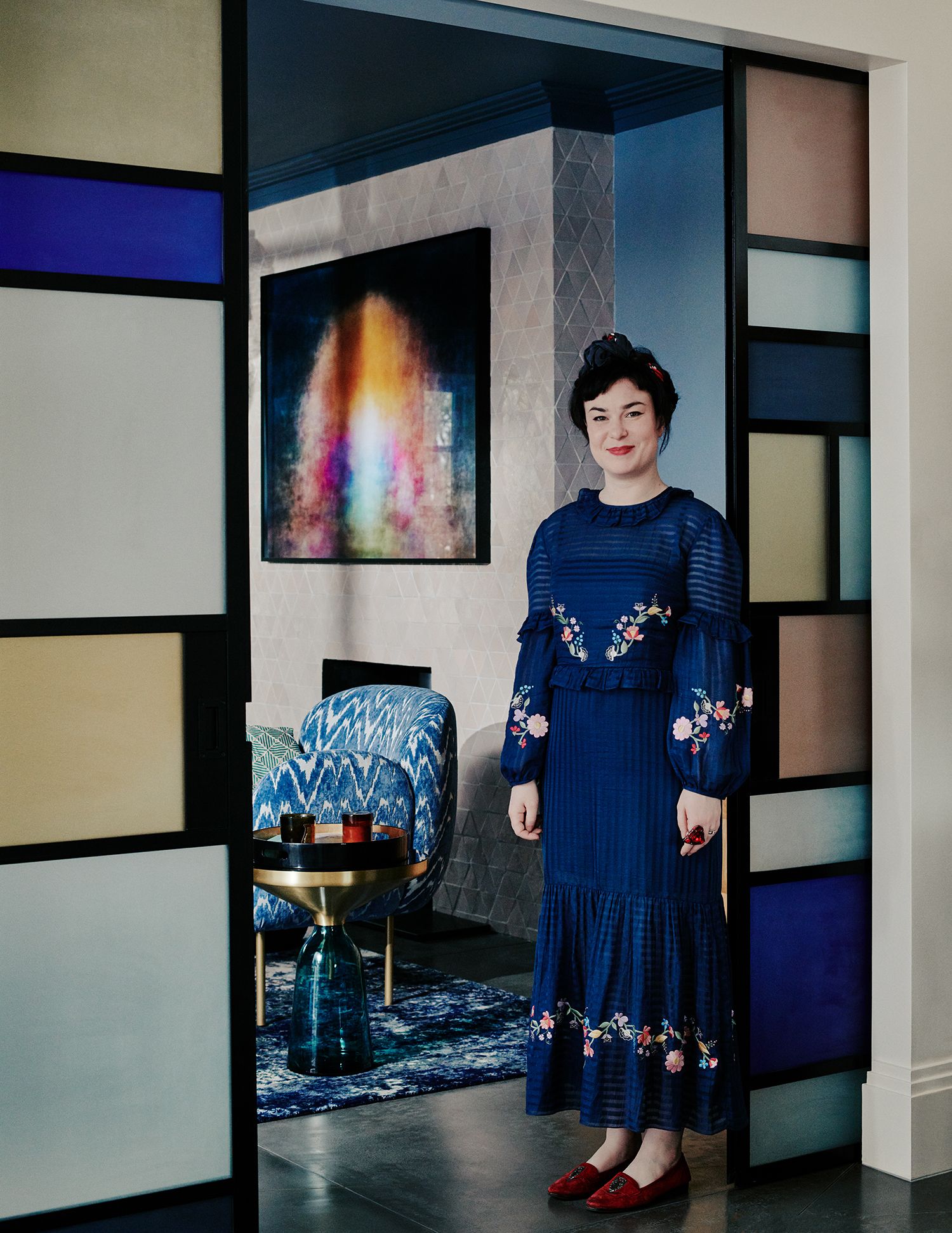 Image may contain Clothing Apparel Human Person Fashion Robe Glass Goblet Gown and Evening Dress