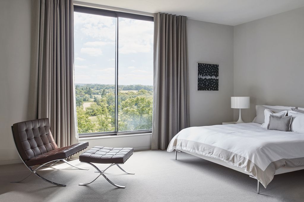 Image may contain Furniture Room Bedroom Indoors Interior Design Home Decor Bed and Living Room