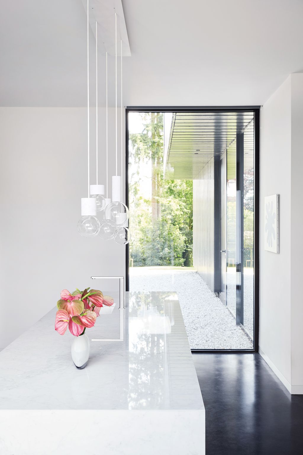 Image may contain Interior Design Indoors Furniture Room Lighting Lobby Door Tabletop and Table