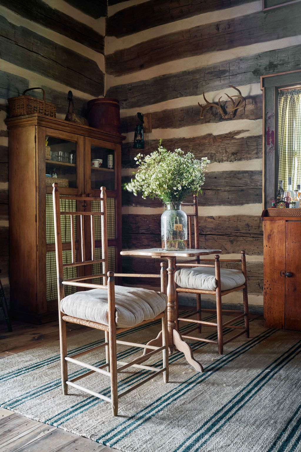 Image may contain Furniture Chair Home Decor Rug Interior Design Indoors Wood Room and Table