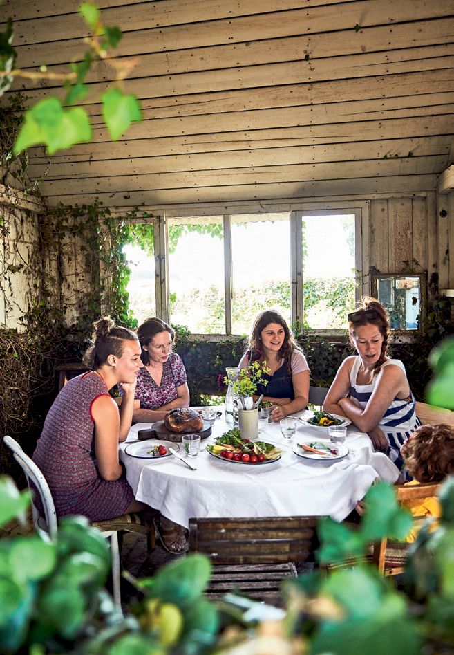 Image may contain Human Person Furniture Dining Table Table Chair Restaurant People Food and Meal