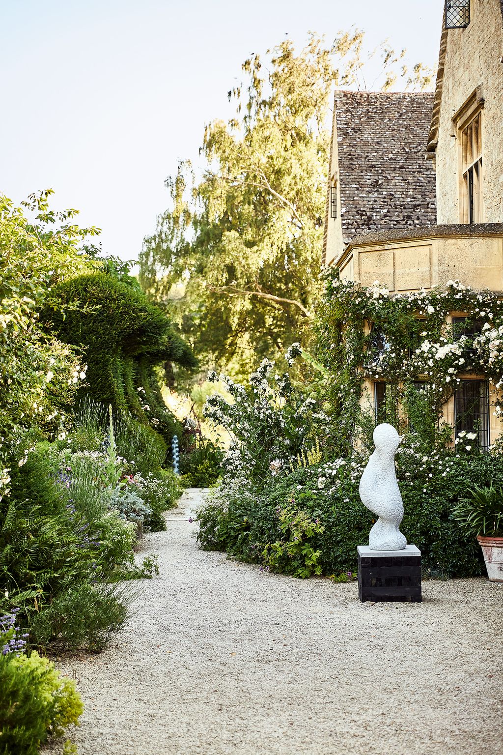 Image may contain Garden Arbour Outdoors Flagstone Animal Bird and Plant