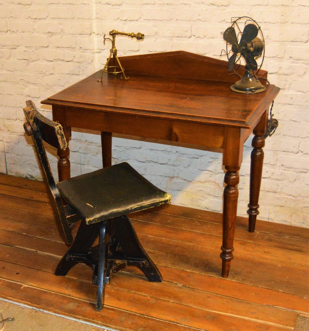 Image may contain Wood Furniture Table Hardwood Chair Desk and Tabletop